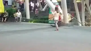 Chick schooling boy at ball game