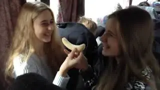 Cute Girls Sharing a Banana