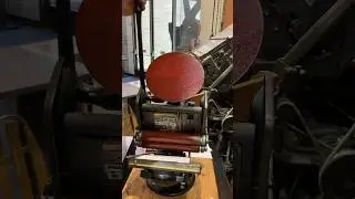 Using a tabletop printing press to print an image of another printing press